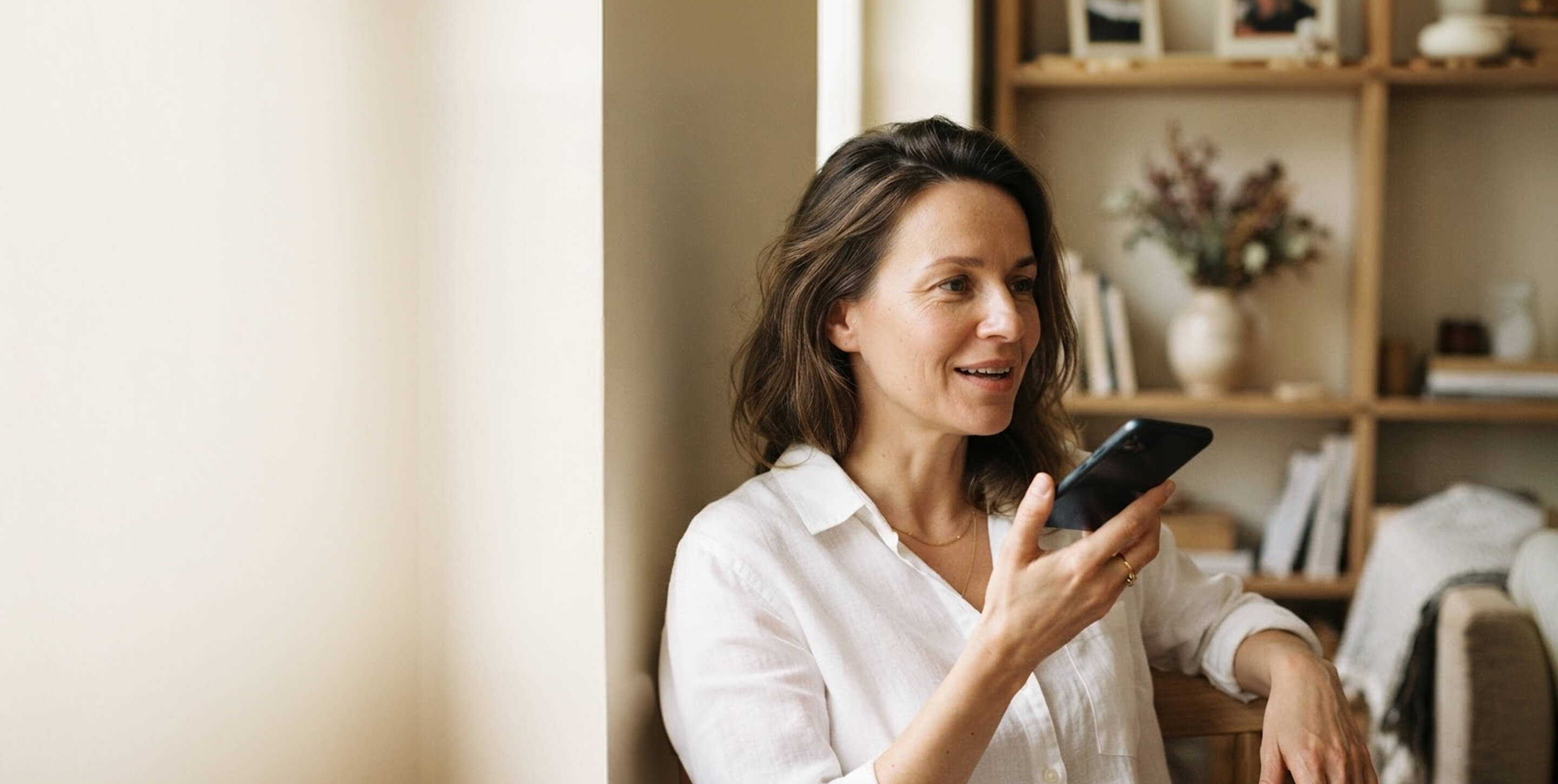 A daughter recording a message for her father